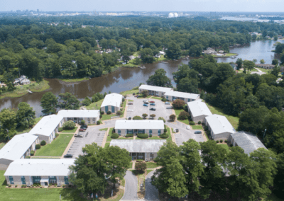 Aerial view of the Marina Point building showcasing their proximity to the water and surrounding landscape